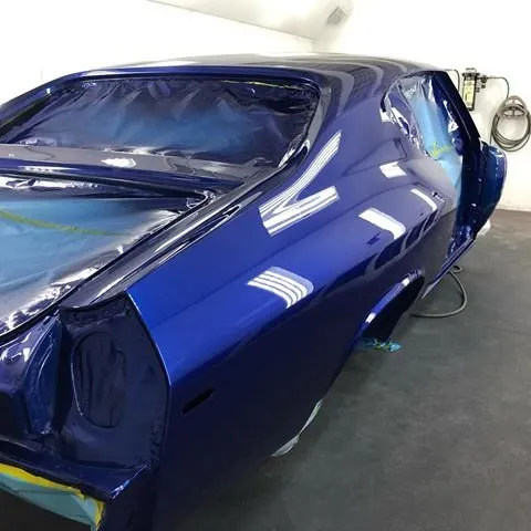 fresh blue paint in the booth