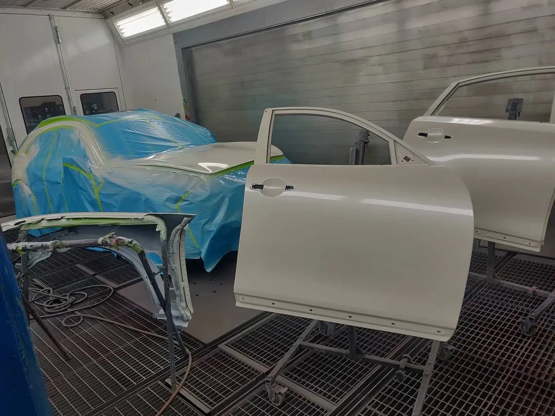 Door panels primed and masked in the paint booth